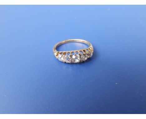 A five stone Victorian/Edwardian graduated diamond ring in yellow metal.  Finger size K/L.