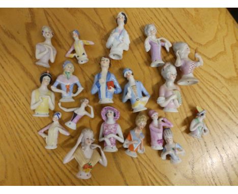 A collection of pin cushion/half dolls.
