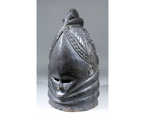 A Mende helmet mask (Ndoli Jowei) for Sande Society, 16ins x 8.75ins