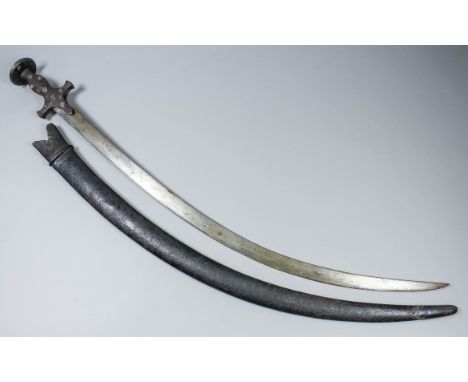 An 18th/19th Century Indian talwar, the 29.75ins steel blade with steel hilt, with bellied grip, short quillons and saucer-sh