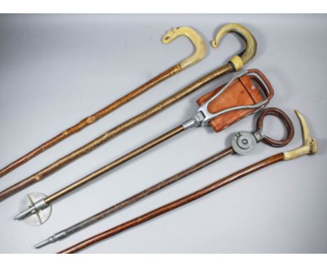 An early 20th Century "Modern" shooting stick, 32.5ins, another "Featherwate", and a collection of nine shepherds crooks and 