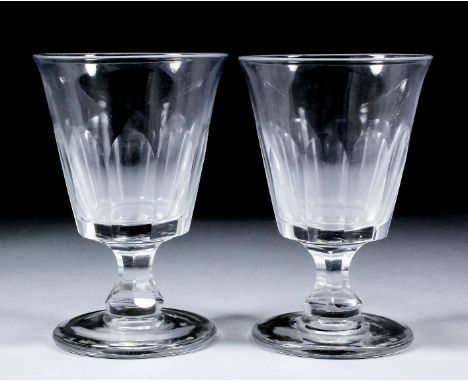 A pair of 19th Century glass rummers with panel-cut bowls and stems, on plain bases, 6.5ins high