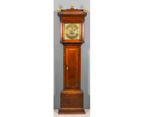 An 18th Century oak longcase clock by Thomas Wolley of Charing, the 12ins square brass dial with wide chapter ring with Roman