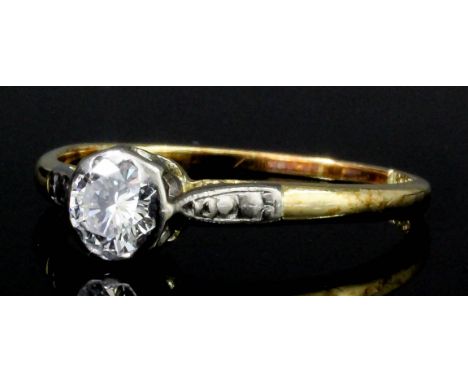 An Edwardian 18ct gold and platinum mounted diamond solitaire ring, the oval old cut stone of approximately .33ct (gross 2.5 