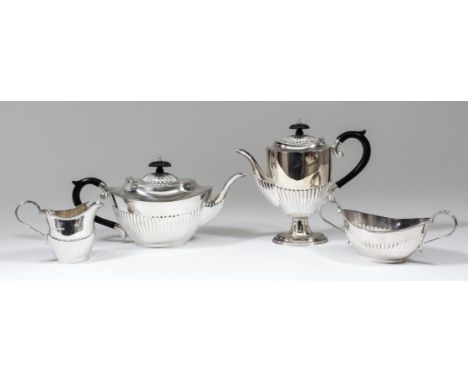 An Elizabeth II silver oval four piece tea and coffee service produced for the J.P. McManus Invitational Pro-am 1995, with pa