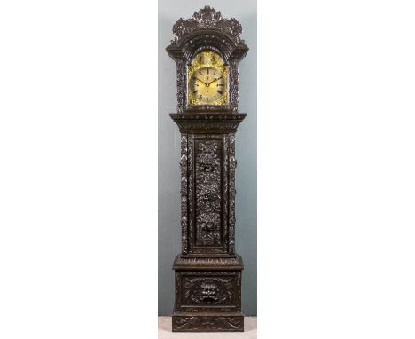 A late 19th Century "Black Oak" longcase clock, the 12ins arched brass dial with silvered chapter ring with Roman and Arabic 