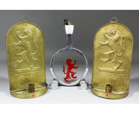 A pair of 1938 Empire Exhibition embossed brass wall candle sconces decorated with a rampant lion, 10.5ins, a chrome lamp dec