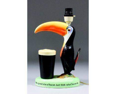 A Carlton Ware pottery Guinness Toucan pattern advertising electric table lamp, 11.5ins high