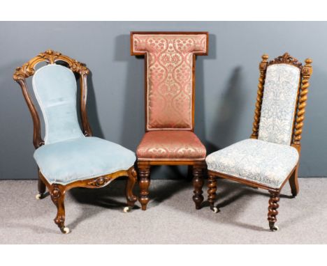 A Victorian walnut framed nursing chair, the scroll moulded frame with scroll carved cresting, seat and shaped panel to back 