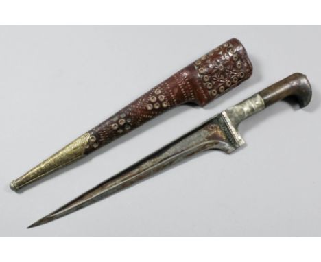 A late 19th/early 20th Century Ottoman kinjal dagger, the 9ins steel blade with engraved silvery metal mounted horn hilt, 13.