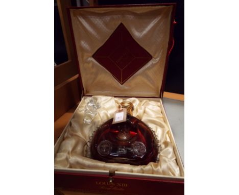 A Louis XIII Remy Martin Grande Champagne Cognac, 70cl in a Baccarat crystal decanter sealed No X0593 with Fleur de lys stopp