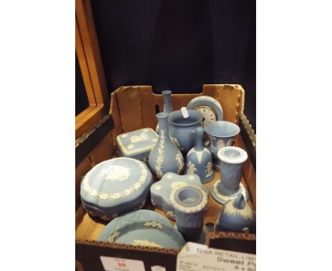 A selection of blue and white Jasper ware to include a clock, vases, trinket boxes, candlesticks etc