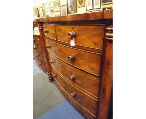 A 19thC Scottish bow front mahogany chest of two short over three long graduated cock beaded drawers, each with turned handle