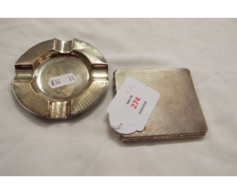 An Art Deco silver and gilt engine turned cigarette case with canted corners dated London 1931 together with an art deco silv