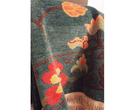 A late 20thC green ground floral decorated Chinese carpet 317 cm x 246 cm  