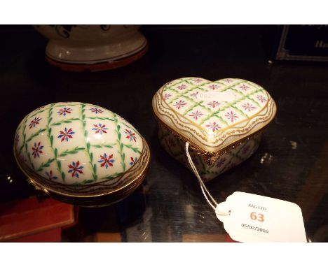 Two matching Vienna porcelain hand-painted floral decorated trinket boxes in the form of a heart and egg each with gilt brass