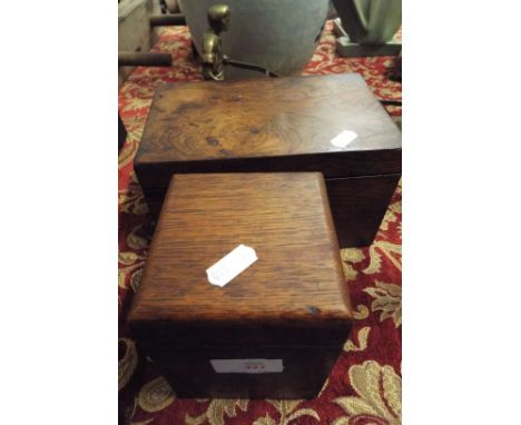 An early 19thC rosewood two section tea caddy together with a single oak tea caddy