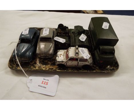 A group of six Dinky die-cast vehicles comprising a Peugeot 203, a Simca 9 Avonde, a Police Mini, a 3 ton army wagon and a ar