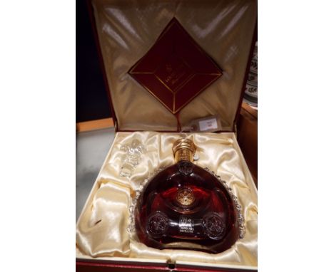 A Louis XIII Remy Martin Grande Champagne Cognac, 70cl in a Baccarat crystal decanter sealed No AA6833 with Fleur de lys stop