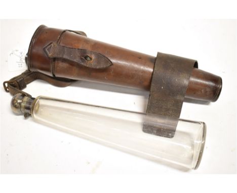 A GLASS FLASK  of tapering outline with silver top contained in a leather holder for saddle mounting, flask 26cm, holder 27cm