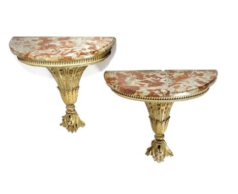 A PAIR OF FRENCH GILT AND CREAM PAINTED CONSOLE TABLES19TH CENTURYeach with a red marble top, above a fluted frieze and with 