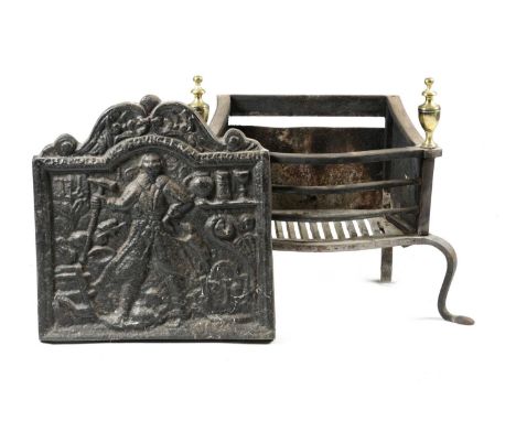 A LATE VICTORIAN CAST IRON FIREBACKLATE 19TH / EARLY 20TH CENTURYdepicting a blacksmith at his forge accompanied by his dog, 