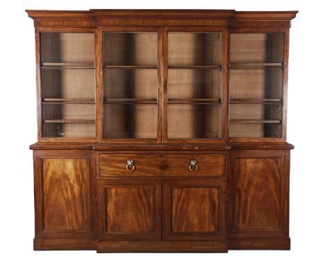 AN EARLY VICTORIAN MAHOGANY BREAKFRONT SECRETAIRE BOOKCASEC.1840-50the moulded cornice above a pair of glazed doors flanked b