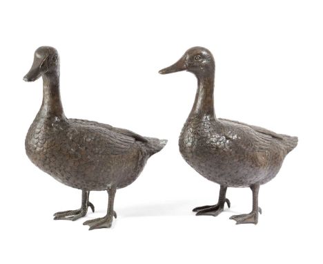 A PAIR OF FLOOR STANDING BRONZE GEESE20TH CENTURYnaturalistically modelled (2)40cm high, 44cm wide, 17.5cm deep (max)