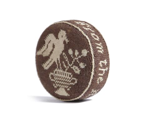 A GEORGE III NEEDLEWORK SAMPLER PIN CUSHIONQUAKER, LATE 18TH / EARLY 19TH CENTURYof circular form, worked in brown and cream 