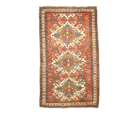 AN EAGLE KAZAK RUGKARABAGH, SOUTH CAUCASUS, C.1900,the deep terracotta field with three typical ivory and olive green medalli