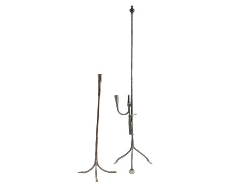 A WROUGHT IRON FLOOR-STANDING TRIPOD ADJUSTABLE RUSHNIP AND CANDLE HOLDERPOSSIBLY 18TH CENTURYwith broad rectangular jaws and