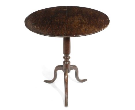 A GEORGE III OAK NAIVE TRIPOD TABLELATE 18TH / EARLY 19TH CENTURYthe circular tilt-top on a turned stem and slender supports6