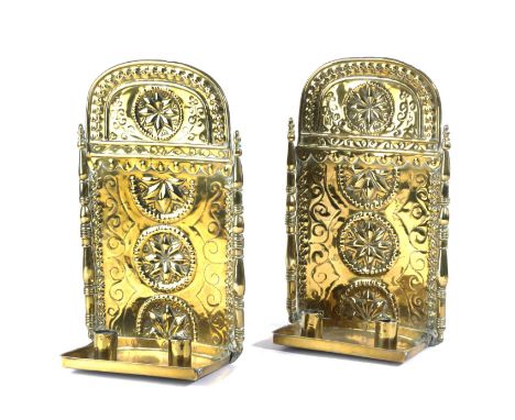 A PAIR OF DUTCH SHEET BRASS TWIN-LIGHT WALL SCONCESEARLY 18TH CENTURYeach repoussé decorated with rondels of stars and punche
