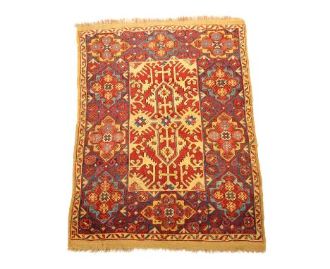 AN ANATOLIAN RUG OF LOTTO DESIGN18TH CENTURY AND LATERthe madder field with central cruciform medallion surrounded by angular