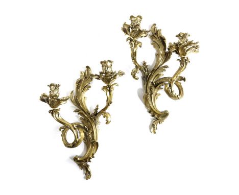 A PAIR OF GILT BRASS TWIN LIGHT WALL APPLIQUESIN LOUIS XV STYLE, LATE 19TH CENTURYwith foliate candleholders, scrolling branc