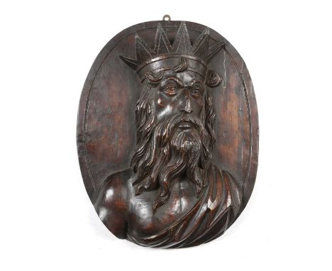 A FOLK ART CARVED PINE PORTRAIT RELIEF BUST OF A BEARDED MAN WITH A CROWNEARLY 19TH CENTURYpossibly depicting Neptune, on an 