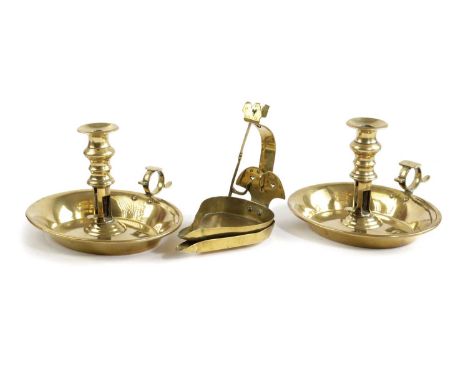 A PAIR OF REGENCY BRASS CHAMBERSTICKSC.1820-30each with an urn shaped nozzle above an ejector mechanism and oval drip-pan, to