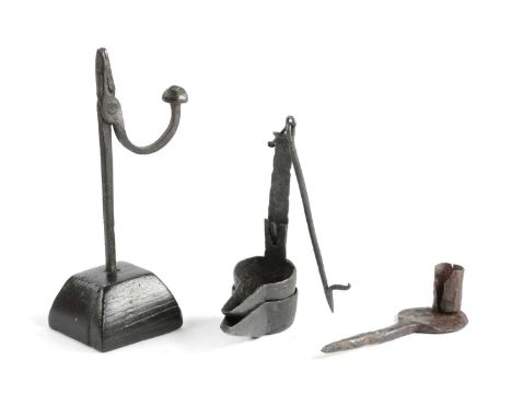 A GEORGE III WROUGHT IRON RUSHNIPC.1800with rounded jaws and a 'U' shaped arm with a flattened ball counterweight, on a taper