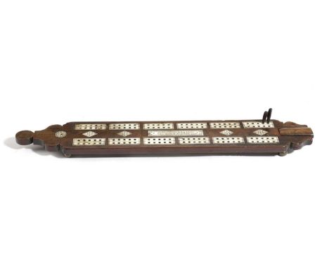 AN EARLY GEORGE III TREEN WALNUT AND BONE CRIBBAGE BOARDDATED '1764'of rectangular form with shaped ends and painted star dec