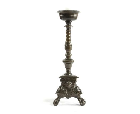 AN ITALIAN BRONZE PRICKET CANDLESTICK IN 17TH CENTURY STYLE with a dished drip-pan over a spiral-twist and knopped stem, on a