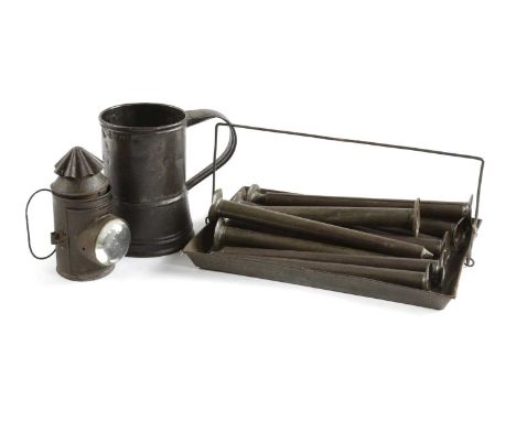 A SET OF ELEVEN TIN CANDLE MOULDS AND CARRYING TRAY19TH CENTURYtogether with a tin bulls' eye policeman's style lantern and a
