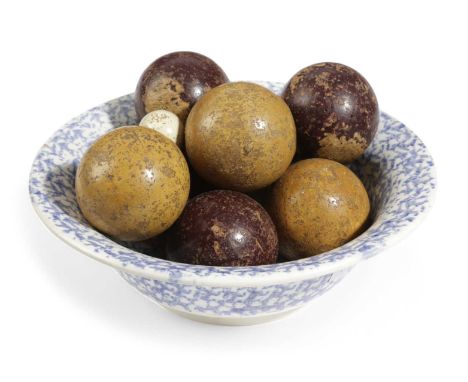 A SET OF EIGHT WOODEN CARPET BOWLSLATE 19TH CENTURYpainted maroon and ochre, together with a jack and a 19th century spongewa