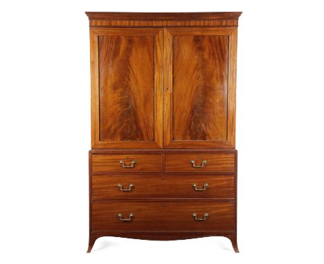 A REGENCY MAHOGANY LINEN PRESSIN THE MANNER OF GILLOWS, EARLY 19TH CENTURYwith a pair of panelled doors enclosing a later bra