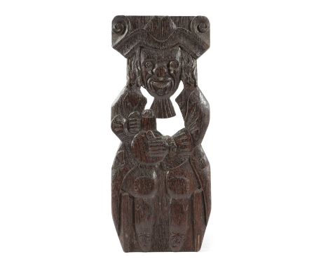 A CARVED AND PIERCED OAK PANEL OF A TOPER19TH CENTURYdepicted seated holding a pitcher of ale36cm highProvenanceThe Howard Co