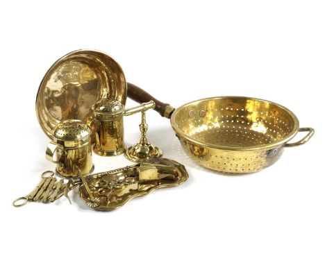 A COLLECTION OF BRASSWARE18TH CENTURY AND LATERto include a strainer, two dredgers or muffiniers, a pair of snuffers with a t