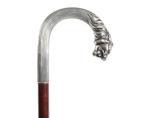 A CONTINENTAL WHITE METAL MOUNTED WALKING STICKEARLY 20TH CENTURYthe silver coloured, reeded handle with a finial in the form