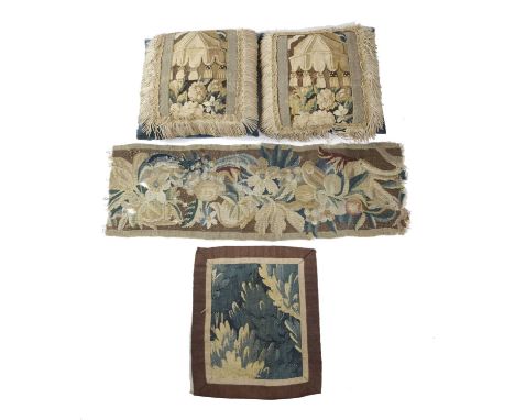 A PAIR OF VELVET CUSHIONSfaced with verdure tapestry fragments, together with three other tapestry fragments (5)33 x 33cmProv