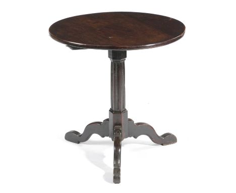 A GEORGE III WALNUT AND OAK TRIPOD TABLEC.1760the circular walnut tilt-top on a fluted hexagonal stem and scroll legs64cm hig