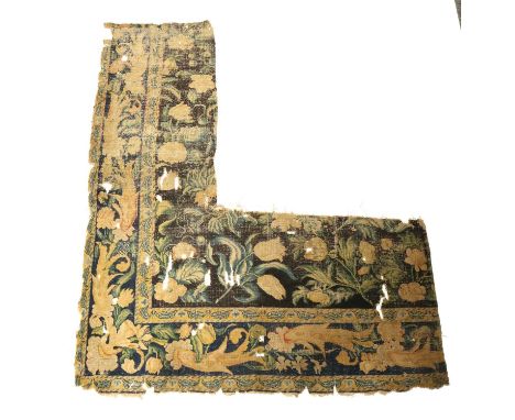 A CARPET FRAGMENTENGLISH OR EUROPEAN, PROBABLY C.1700the deep indigo field of naturalistic flowers and leafy plants enclosed 