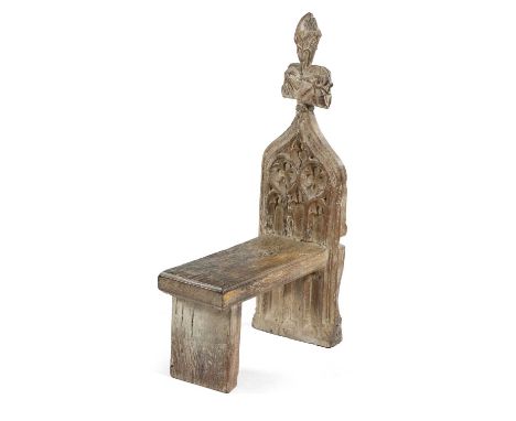 AN OAK POPPY HEAD PEW END STOOLMID-15TH CENTURY AND LATERcarved with quartrefoils and arches94.5cm high, 28.5cm wide, 54.5cm 